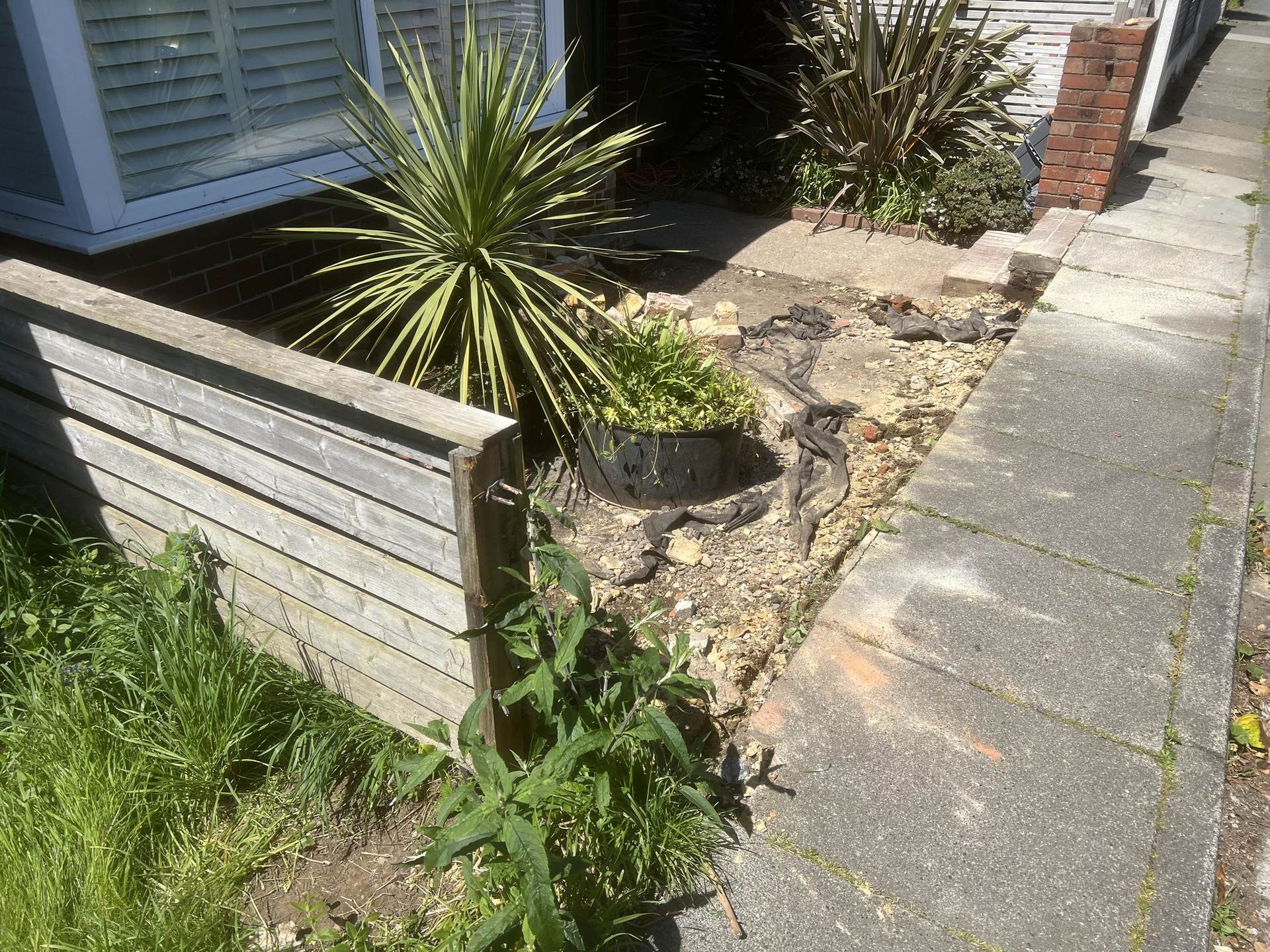 Old membrane and rubble cleared from the front garden before rebuilding